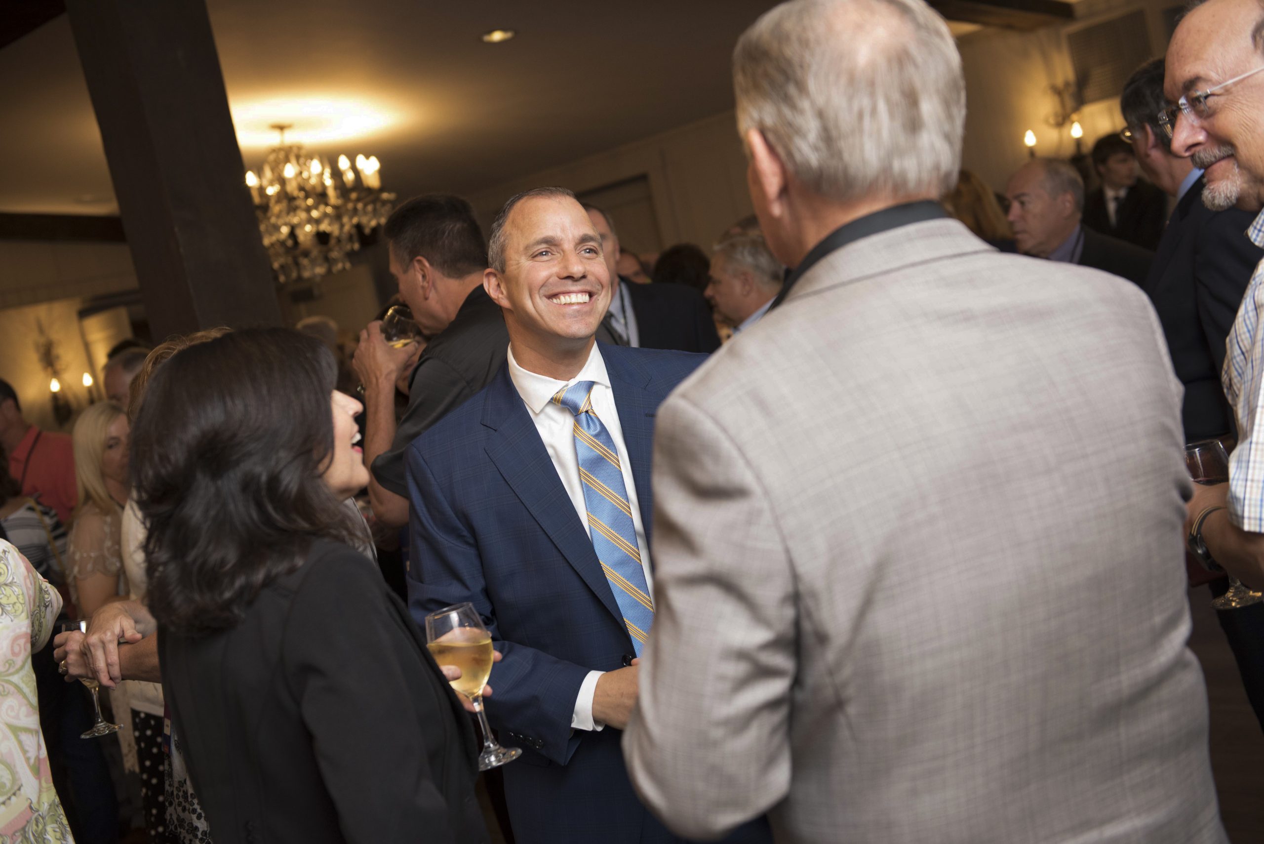 Dan Barram with clients at an event